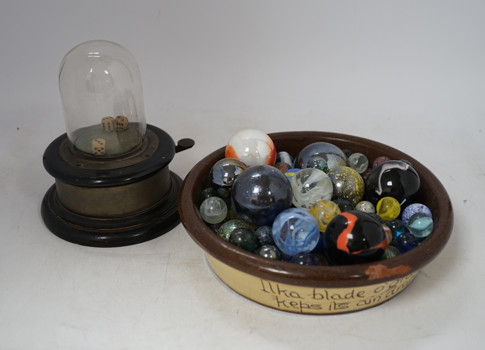 Sundry items to include glass eggs, marbles, a set of three tins in the form of books and a straw work box, etc. Condition - mostly fair